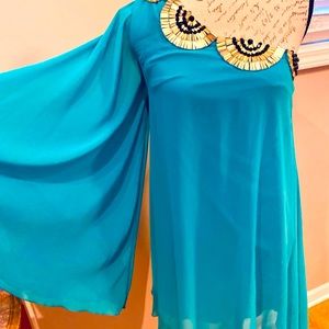 One shoulder sheer dress.